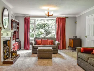a living room with a couch and a window at Court House in Halsall