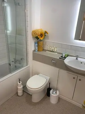 a bathroom with a toilet and a sink at Kensington Luxury Apartment on Gated Development in Leafy edge of Chorley Town Centre in Chorley