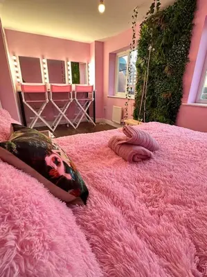 a pink bedroom with a large pink bed at #1 Most Viral Pink House w Ball Pit in Liverpool