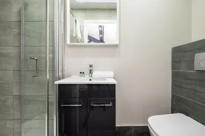 a bathroom with a sink and a shower at Host & Stay - The Coachouse at Pilgrim St in Liverpool