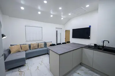 a living room with a couch and a tv in a room at Cozy Charming Bungalow BRAND NEW in Preston