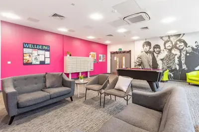 a waiting room with couches and a pool table at For Students Only Glassworks in Liverpool in Liverpool