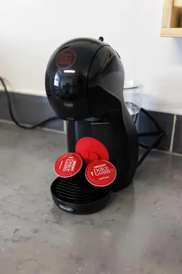 a coffee maker with three red buttons on it at Flatzy - Sleeps 16 Near Football Ground & Ping Pong Table in Liverpool