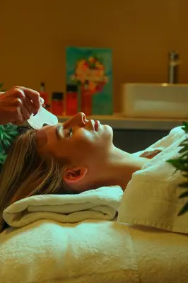 a woman laying on a bed getting her hair brushed at Park hall Hotel & Spa Lancashire, a member of Radisson Individuals in Eccleston