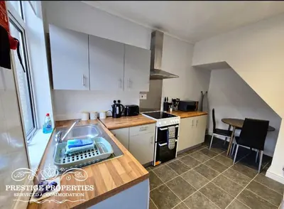 a kitchen with a sink and a counter top at Warwick St by Prestige Properties SA in Barrow in Furness