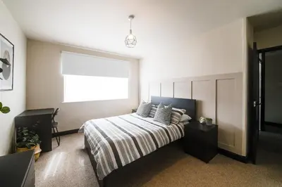 a bedroom with a bed and a window in it at Poppy's Place - Manningham Road in Liverpool