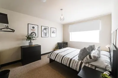 a bedroom with a bed and a window at Poppy's Place - Manningham Road in Liverpool