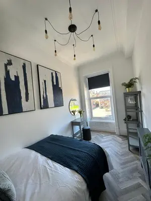 a bedroom with a bed and a window at No 3 ,luxury 2 bed 1st floor apartment with free parking,Lytham St Annes in Saint Annes on the Sea