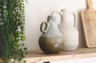 a group of vases sitting on a shelf with plants at xxBrand Newxx sleeps 8, stylish japandi house in Blackpool