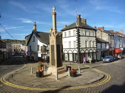 a town with a clock tower in the middle of a street at Modern 3 Bed Barn Conversion in Great Urswick in Great Urswick