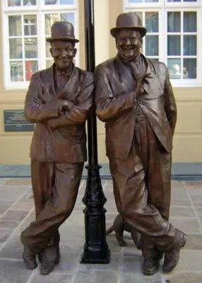 a statue of two men standing next to a lamp post at Modern 3 Bed Barn Conversion in Great Urswick in Great Urswick