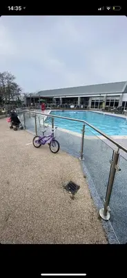a purple bike parked next to a swimming pool at Caravan - Sleeps up to 8 & Free parking in Grange Over Sands
