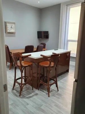 a dining room with a table and chairs at Imperial view in Blackpool