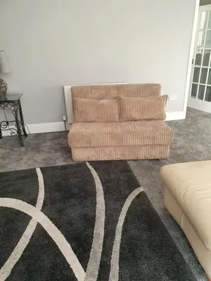 a living room with a couch and a rug at Imperial view in Blackpool