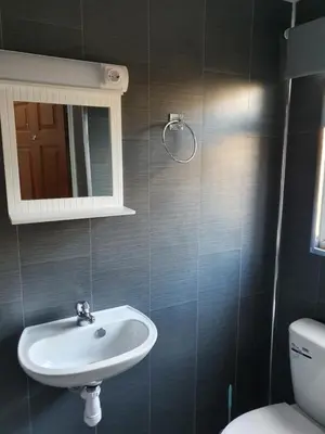 a bathroom with a sink and a toilet at Imperial view in Blackpool