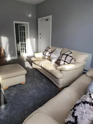 a living room with a couch and a table at Imperial view in Blackpool