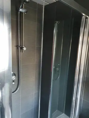 a shower with a glass door in a bathroom at Imperial view in Blackpool