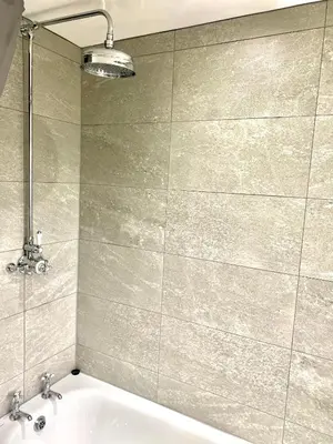 a bathroom with a bath tub and a sink at 2 bed house sleeps 4-5 in Liverpool