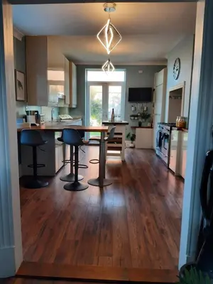 a kitchen and living room with a table and chairs at Lytham Luxury in Saint Annes on the Sea