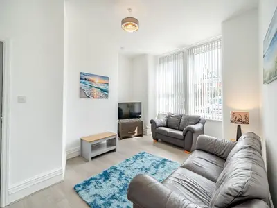 a living room with a couch and a tv at One - Uk43696 in Saint Annes on the Sea