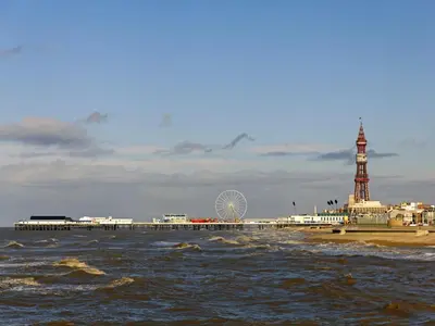 a pier with a clock tower and the ocean at One - Uk43696 in Saint Annes on the Sea