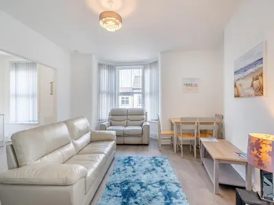 a living room with a couch and a table at Two - Uk43700 in Saint Annes on the Sea