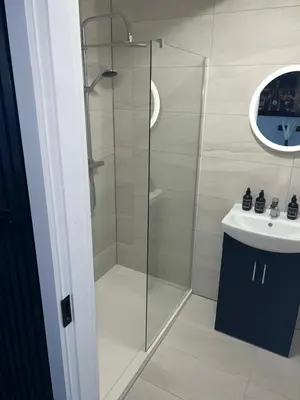 a bathroom with a shower and a sink at 128 Anfield Road in Liverpool