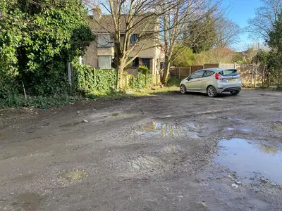 a small silver car parked in a driveway at The Snug on Hornby in Morecambe