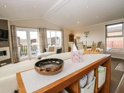 a living room with a table with a bowl on it at Walkers Rest in Carnforth