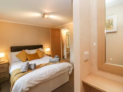 a bedroom with a bed with two teddy bears on it at Walkers Rest in Carnforth