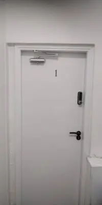 a door in a white room with aperature at LFC Stadium Apartment 1 in Liverpool