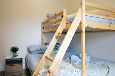 a bunk bed in a bedroom with a bunk bedutenewayewayangering at LFC Stadium Apartment 2 in Liverpool