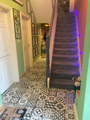 a staircase in a house with a tile floor at Tuebrook Towers in Liverpool