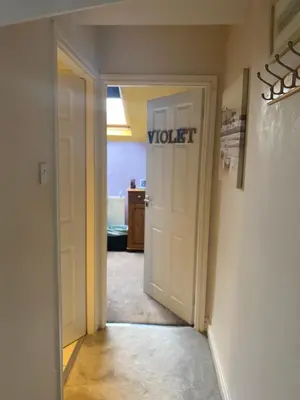 an open door with the word violet written on it at Tuebrook Towers in Liverpool