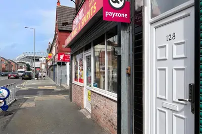 a building with a sign on the side of a street at LFC Stadium Apartment 4 in Liverpool