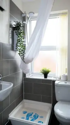 a bathroom with a toilet and a window at LFC Stadium Apartment 4 in Liverpool