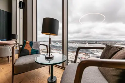 a living room with a view of a city at The Lexington - Luxury Serviced Apartments City Centre - City and Waterfront views in Liverpool