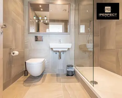 a bathroom with a toilet and a sink and a shower at The Lexington - Luxury Serviced Apartments City Centre - City and Waterfront views in Liverpool