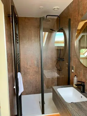 a bathroom with a shower and a sink at Large Country Farmhouse in Waddington