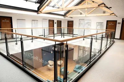 a large glass case in a room with wooden floors at Theodore House in Clitheroe