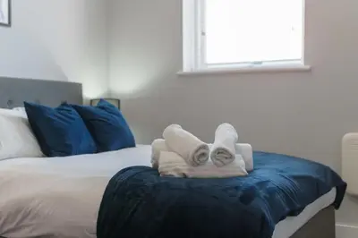 a room with a bed with two towels on it at Modern 1 Bedroom Apartment in Liverpool in Liverpool