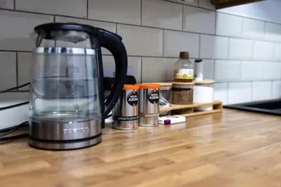 a blender sitting on a kitchen counter with spices at COZY PLACE LIVERPOOL in Liverpool
