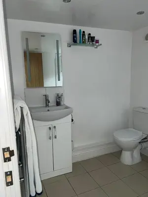 a white bathroom with a sink and a toilet at COZY PLACE LIVERPOOL in Liverpool