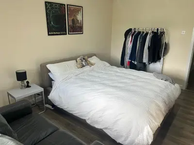 a bedroom with a bed with a teddy bear on it at Spacious 2 Bed Ribble Valley Apartments in Blackburn