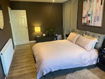 a bedroom with a large white bed in it at Spacious 2 Bed Ribble Valley Apartments in Blackburn