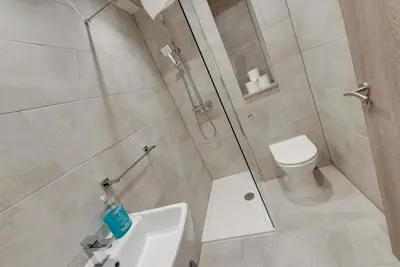 a bathroom with a shower and a sink and a toilet at Liverpool Short Stay Apartments in Liverpool