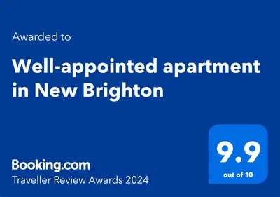 a blue sign with the words well appointed appointment in new butterfly at Well-appointed apartment in New Brighton in New Brighton