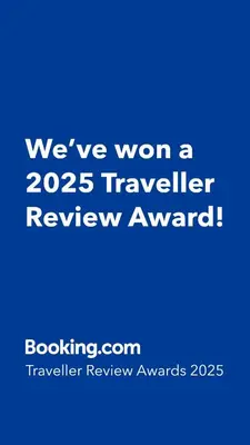 a blue sign that says weve won a traveler review award at Well-appointed apartment in New Brighton in New Brighton