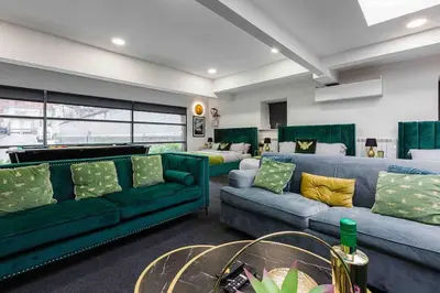 a living room with couches and a pool table at VIP city centre apartment with secure free parking in Liverpool